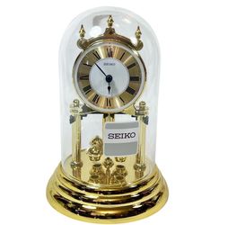 Seiko Anniversary Clock Gold Tone Rotating Pendulum Glass Cover Analog Quartz