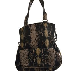 Gretta python  hobo bag with leopard interior with pockets and extra strap