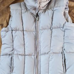 Girls puffy jacket vest , beige neutral color sleeveless,  turtle neck.. small says L but its smal size see measurements for waist sizel n length