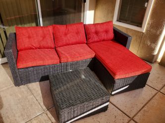 Wicker sofa chaise with table