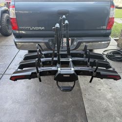Thule epos 3  holds three bikes great for ebikes has locks for each bike,has wheels to roll it, flips back so you can get in back of car rack was only