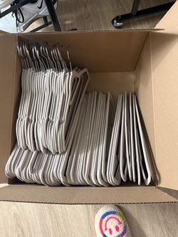 Bulk Lot of Velvet Non-Slip Clothes Hangers in taupe.