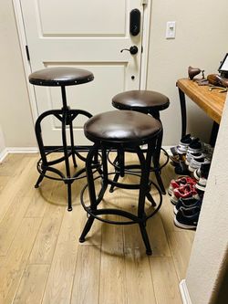 A backless bar stool, level with the bar counter set of 3