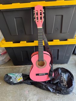 Pink Acoustic Guitar with bag.
