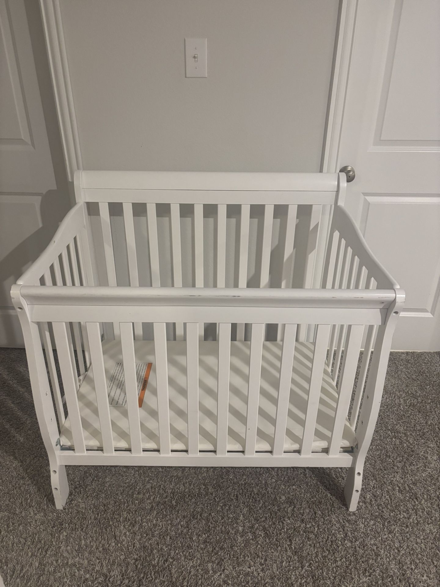Title: White Mini Baby Crib – Fair Condition