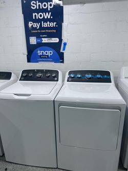 BRAND NEW GE WASHER AND DRYER. SET.