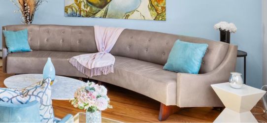 Mid-century Modern Curved tufted leather sofa