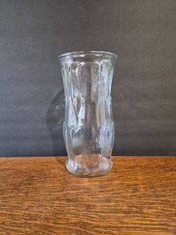 Vintage Clear Glass Vase 9.5" by E.O. Brody featuring a textured feather or leaf pattern along its flared, hourglass-shaped body.