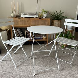 white bistro set - two folding chairs and table