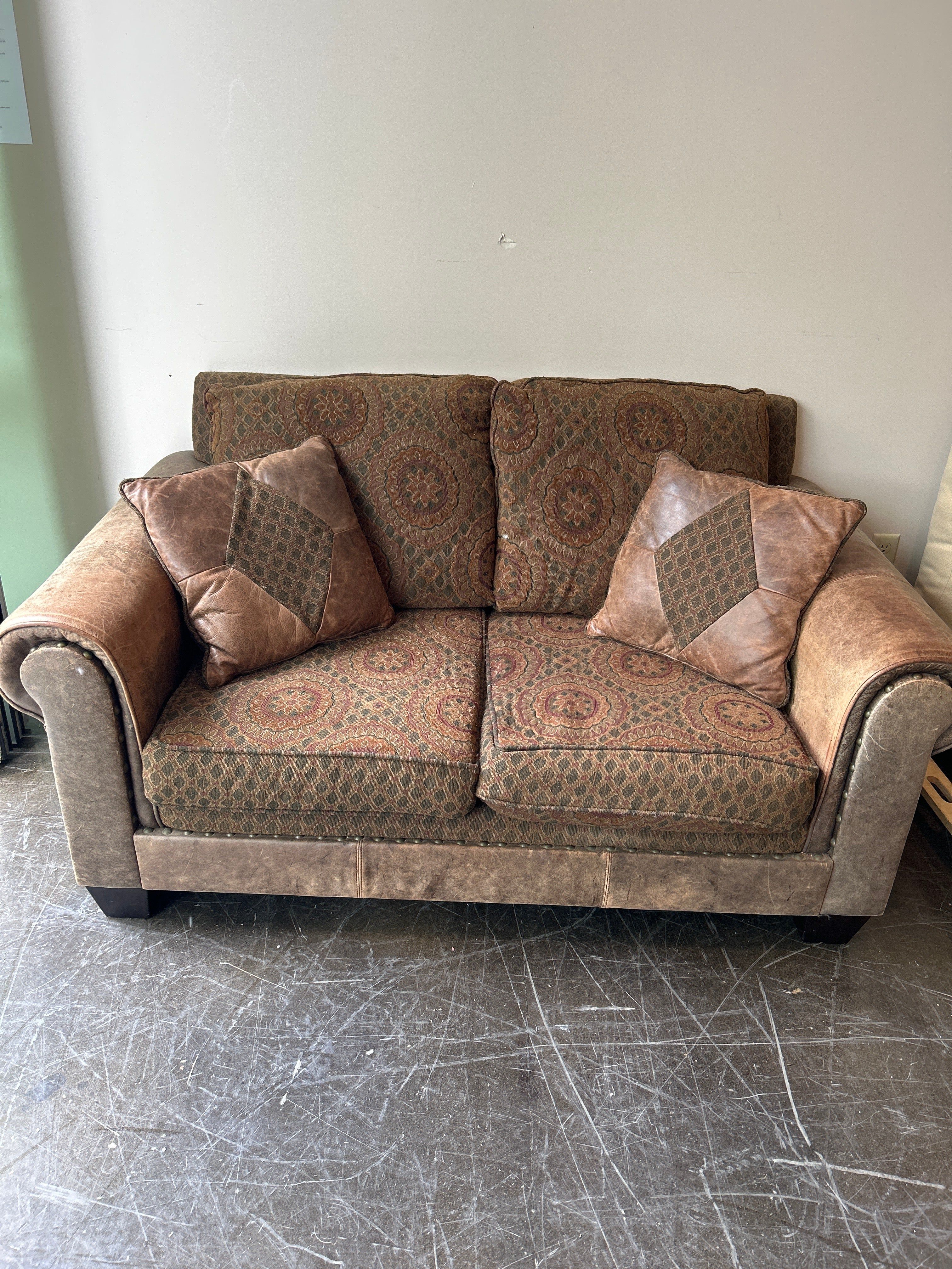 Brown and Rust Pattern Loveseat with Leather Accent