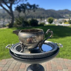 Vintage silverplated creamer with ornate handles