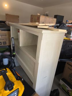 Pottery barn wooden twin bed with matching dresser.