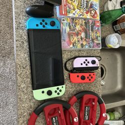Nintendo Switch OLED with games and accessories