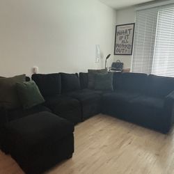 Black sectional couch 3 storage compartments and fold out bed