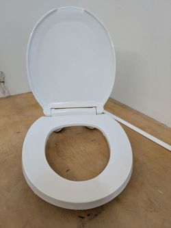 ADA Raised Toilet Seat with Cover - Round - White - great condition