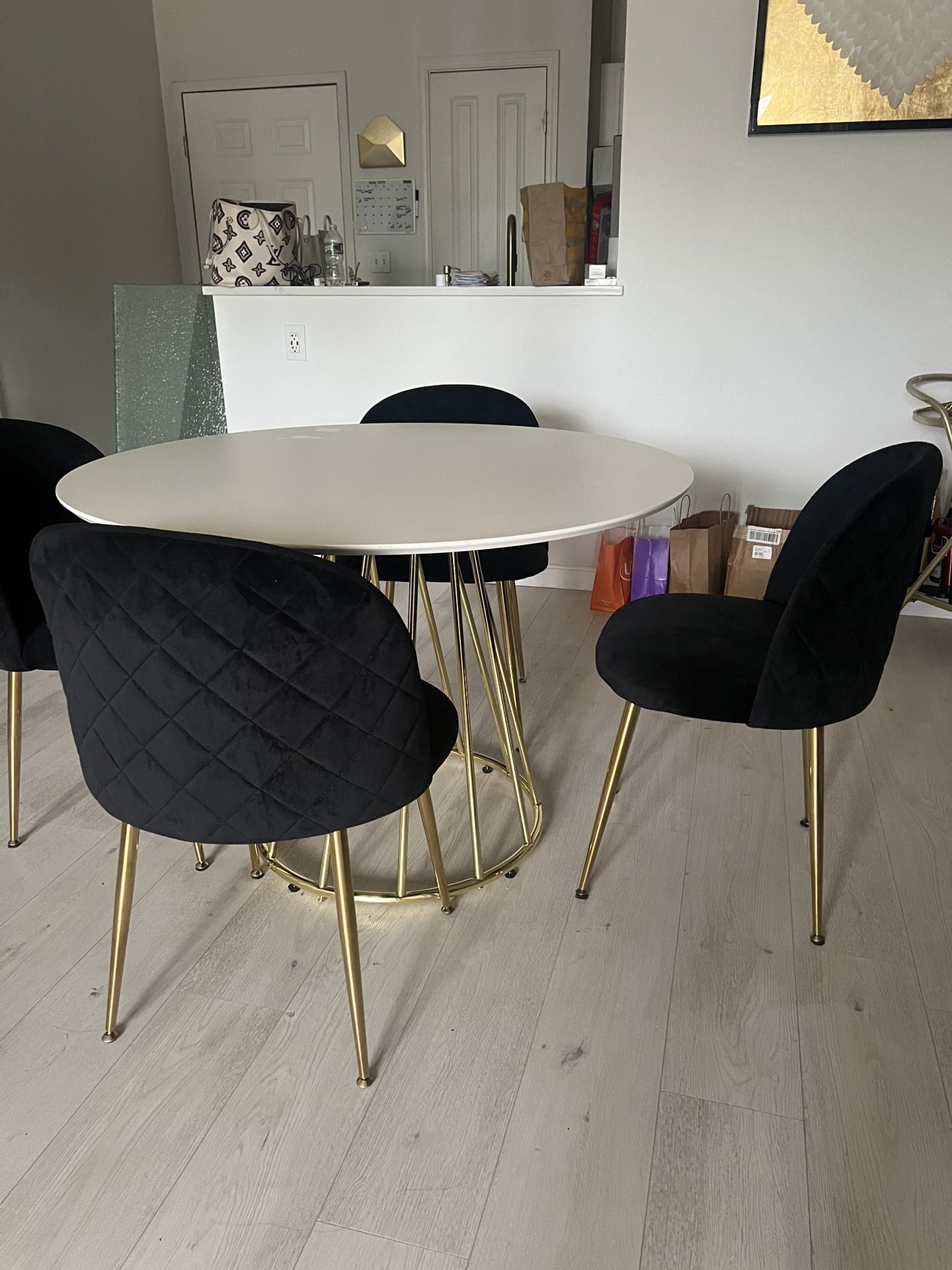 White Round Dining Table With Gold Base & 4 Black Velvet Chairs