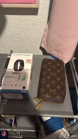 New Fitbit (sz large) and wallet  30.00 each
