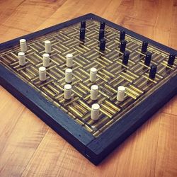 Hand made bullet casing checker board game. (357's and oak boarder)