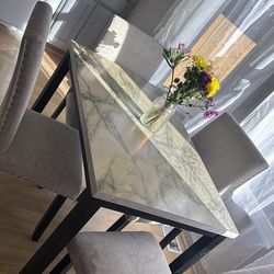 Table and chairs $50.  Pick up In Marysville .  Some stains