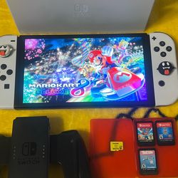 Nintendo Switch Oled. Perfect Condition Like New. 4 Games And Complete With Accessories. TV Dock. Mario Kart 8 Deluxe Included
