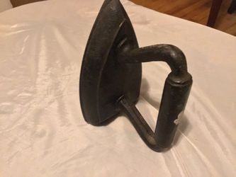 Cast Iron Old World antique iron. Heavy enough to be a doorstop and can also be used as a book end. Beautifully hand painted,