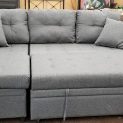 Small reversible sofa chaise sectional with a pullout bed