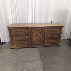 Traditional Brown Wood Dresser with Ornate Hardware