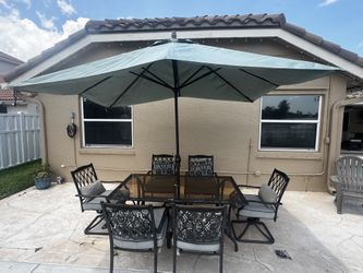 Hampton Bay table, 6 chairs, Sunbrella (unbrella)