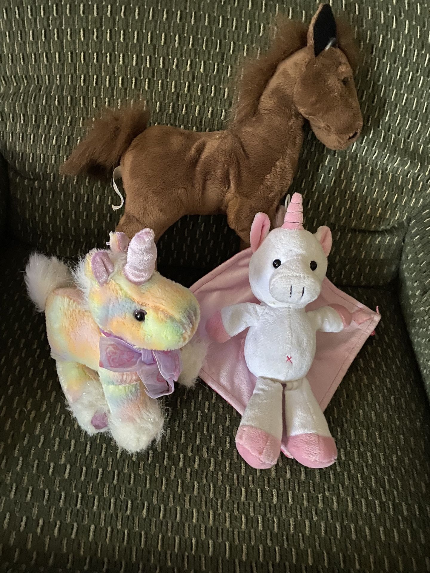 Two unicorns and a horse stuffed animals