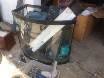 Curved glass aquarium with filtration lights etc
