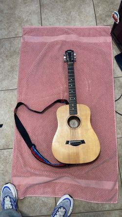 Taylor 2002 baby guitar made in USA with a Taylor’s guitar bag