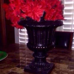 Vintage distressed planter/vase with a modern textured finish and bright red flowers make a beautiful centerpiece for any table.