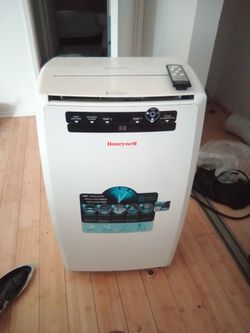 Honeywell portable AC, dehumidifier and fan with remote control and exhaust.