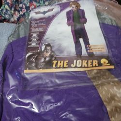 Joker's costume brand new comes with a makeup in a separate plastic bag brand new never used