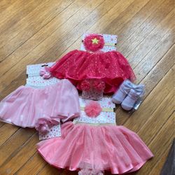 Three newborn to two outfits plus bonus booties
