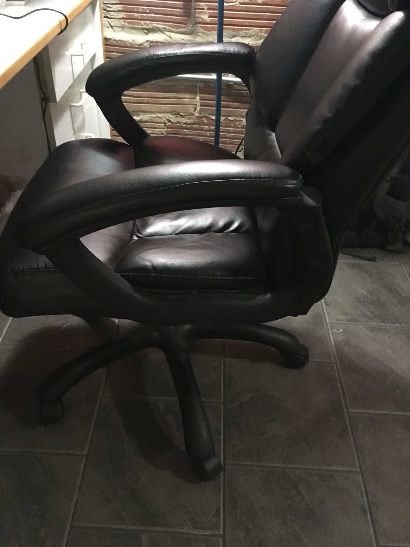 Black leather rolling arm chair