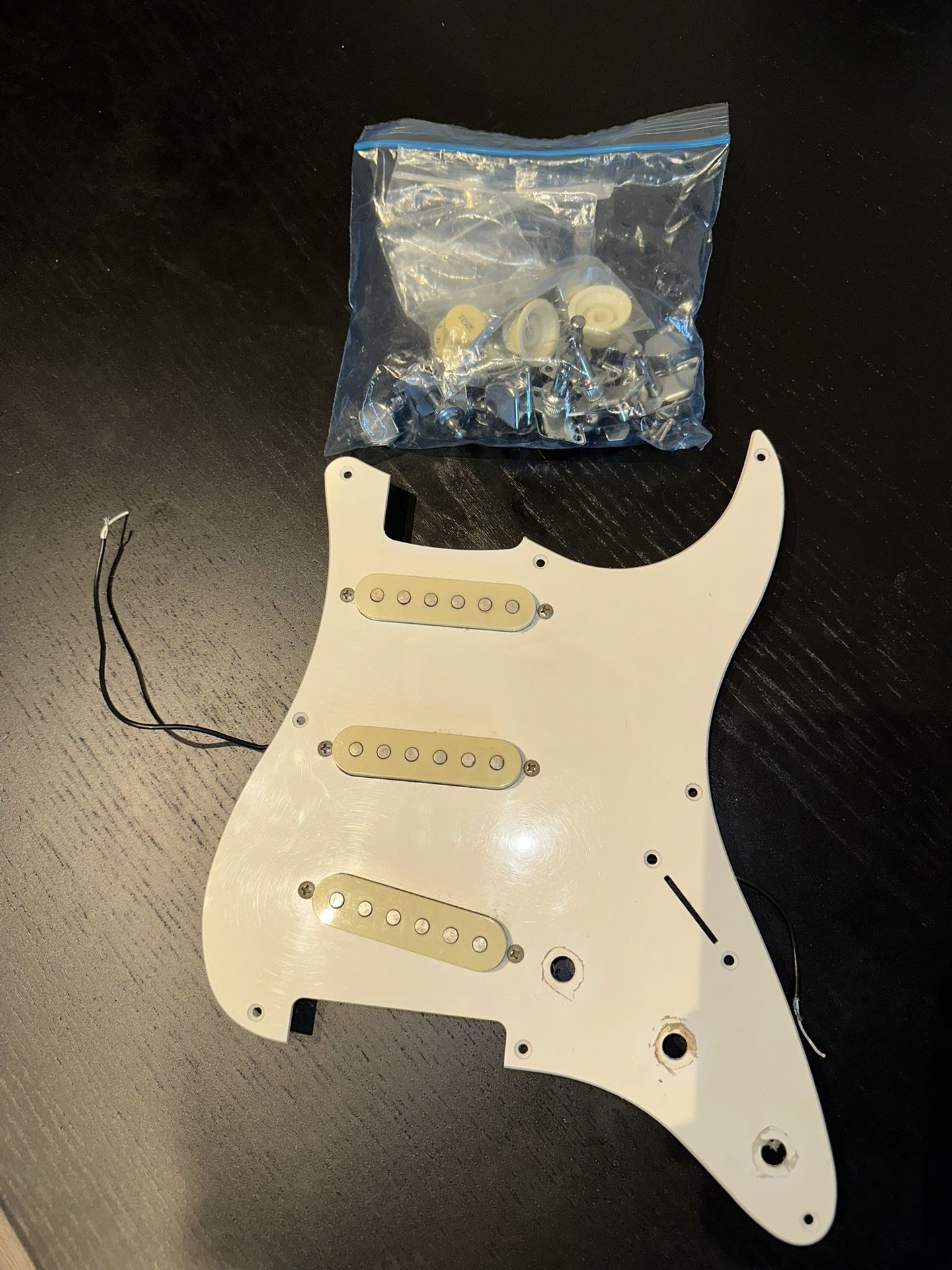 Loaded strat pick guard + tuners, knobs and an input jack