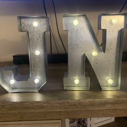 9” aluminum light up N & J letter signs