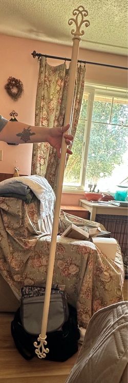 Ivory colored metal curtain rod