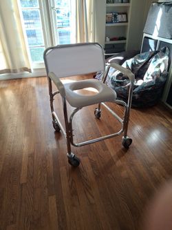 Fairly new rolling Shower Chair $80