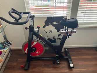 Sunny Health & Fitness Stationary Exercise Bike Machine w/ Adjustable Cushion Seat & Multi-Grip Handlebar, Indoor Cycling Equipment for Home Cardio Tr