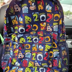 This is a Disney Parks 2020 Mickey and Friends navy blue backpack