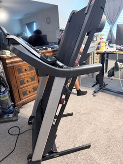 Folded-up ProForm ZT6 Treadmill stored in upright position