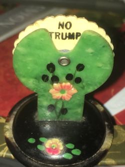 I think this is part of a card game - it has ♥️♠️♣️♦️and No Trump- I think that is funny