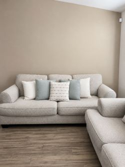 Light beige sofa set w/decorative pillows
