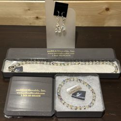Brand new handmade Swarovski crystal necklace, stretch bracelet, and earrings.