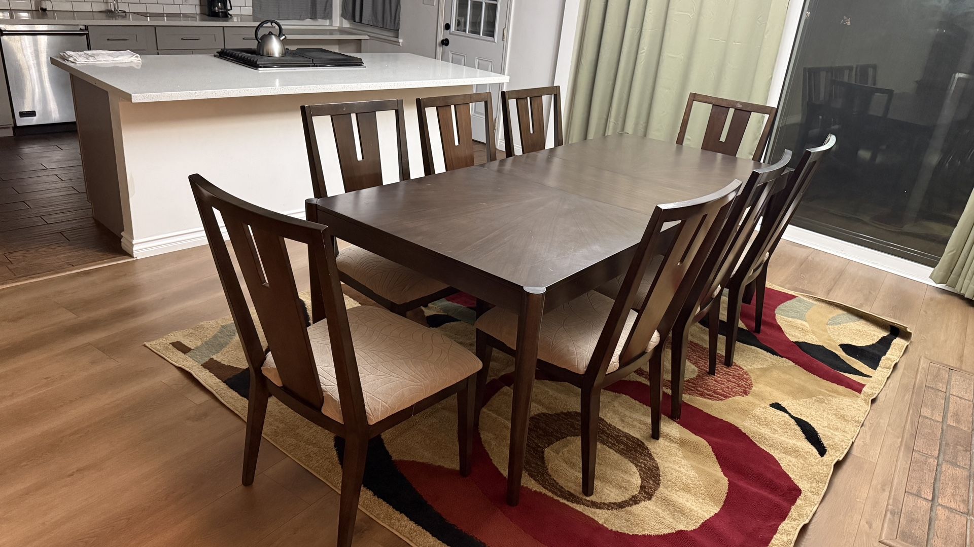 Used Wooden Dining Table and 8 Chairs in Working and Like New Condition