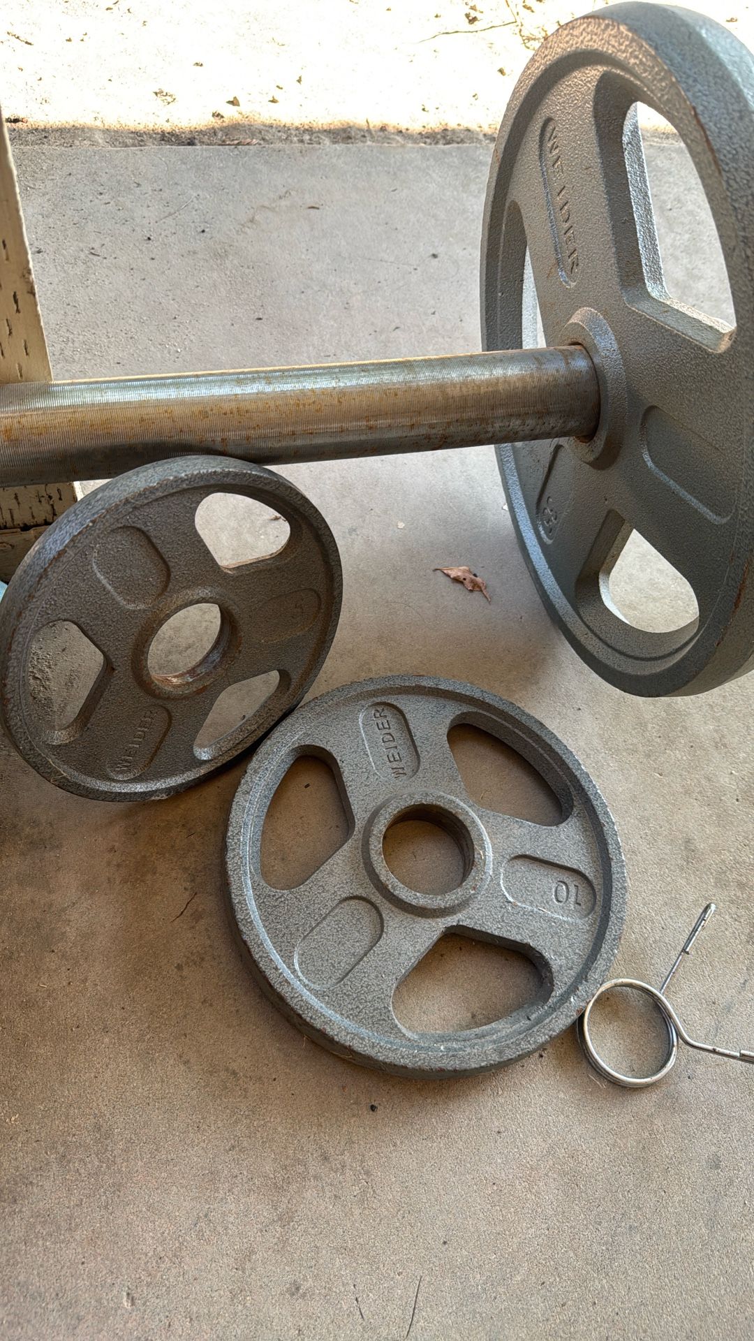 45 Pound Barbell along with , 2 (35 Pound Plates) 2 (10 Pound Plates) 2 (5 pound Plates).