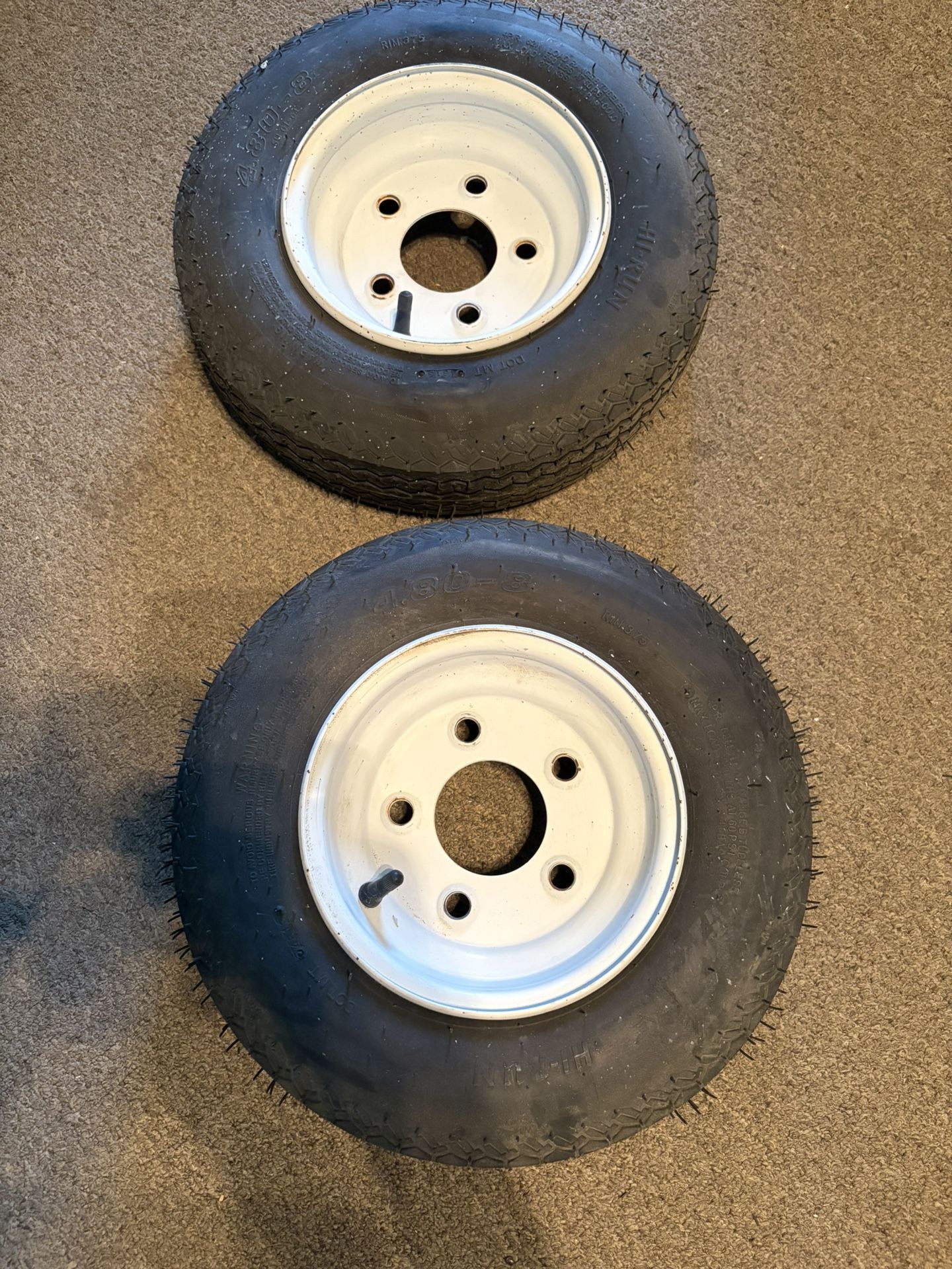 2 Trailer Wheels With Mounted Tires.  5 On 4-1/2 Inch Lug Spacing. Load Range B. 8 Inch Rims. Bias Ply Tubeless. Like New, Never Used. 