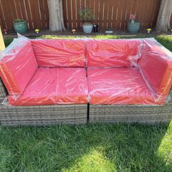 4 Piece Set- 2 Ash Gray Corner Wicker Chairs w/ Red Cushions & 2 matching large ottoman - New in box